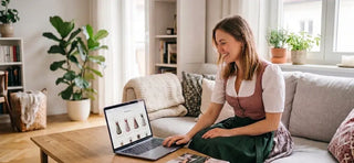 Woman buying a traditional dirndl online, comparing Bavarian dress styles for Oktoberfest from the comfort of home.