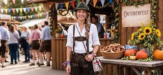 Traditional women's Lederhosen paired with a white blouse and Alpine accessories for Oktoberfest.