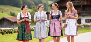 Women wearing traditional Dirndl styles showcasing classic Bavarian dresses for first-time buyers.